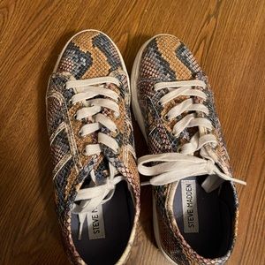 Steve Madden snakeskin platform sneakers.